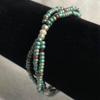 Green 8/0 seed bead triple strand bracelet with gray, red, silver, pearlescent accents