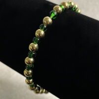 Gold and green 6/0 glass seed bead and metal beads